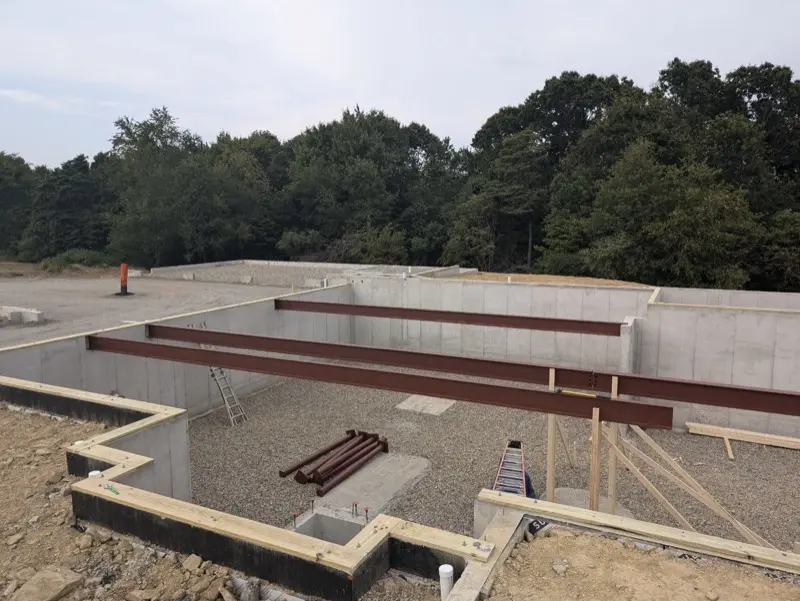 Residential poured concrete foundation with steel beams in Butler County PA
